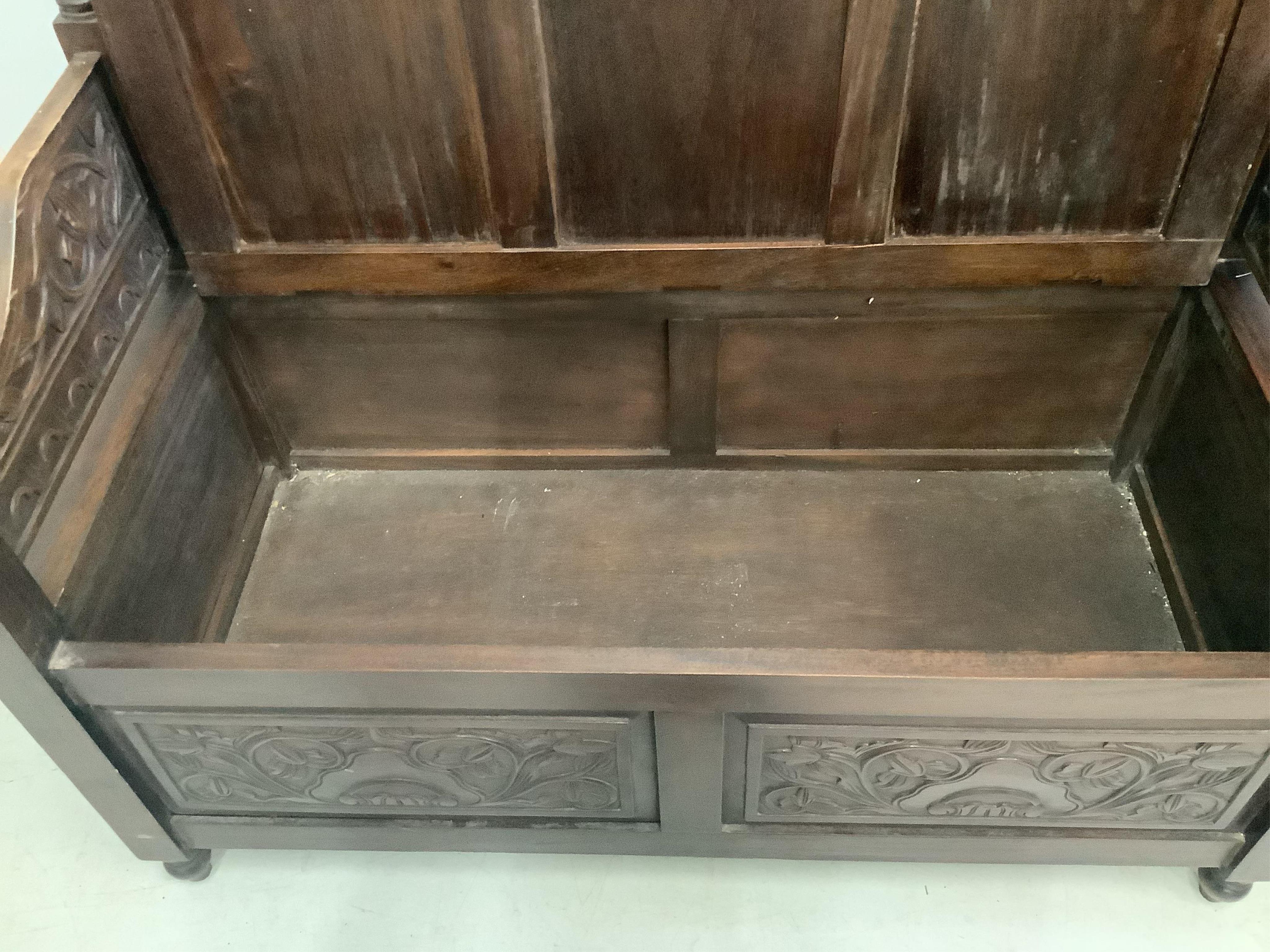 A pair of hardwood monks benches, width 100cm, depth 48cm, height 75cm. Condition - good